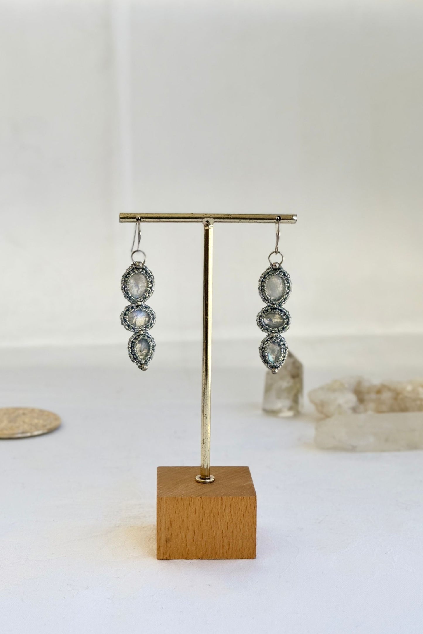 Detailed close-up of the unique gemstone design of this handmade macrame earrings. Showcasing it's elegance and natural textures of the jewelry piece.