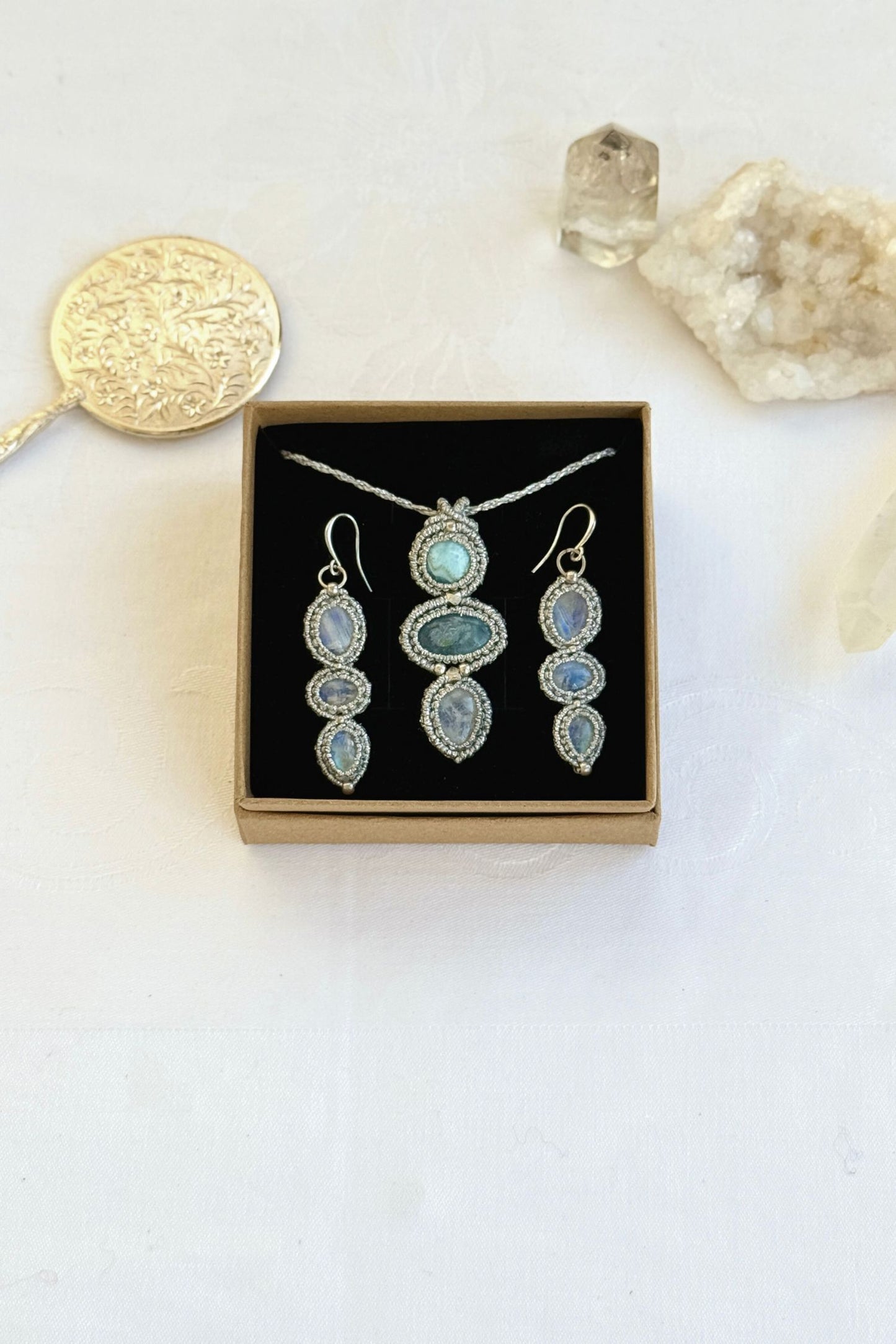 Display of the Moonstone earrings with a matching macrame gemstone necklace. A perfect handmade gift setting.