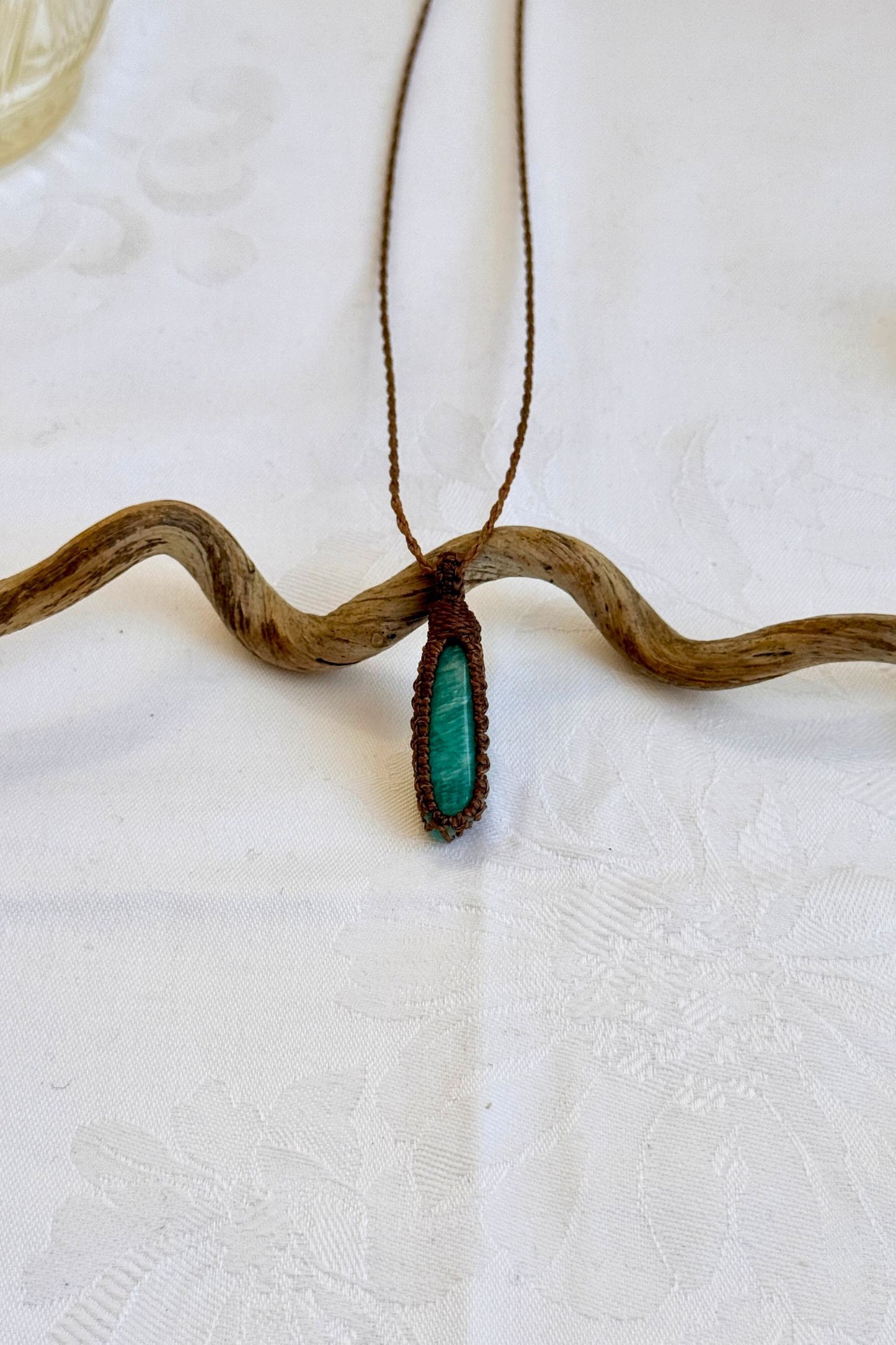 Handmade Amazonite Macrame necklace featuring a high-quality gemstone, laid flat to showcase its delicate everyday-wear design from the Essence collection.