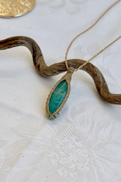 Side angle view of the Amazonite Macrame necklace, showing the fine macrame details and the unique gemstone centerpiece.