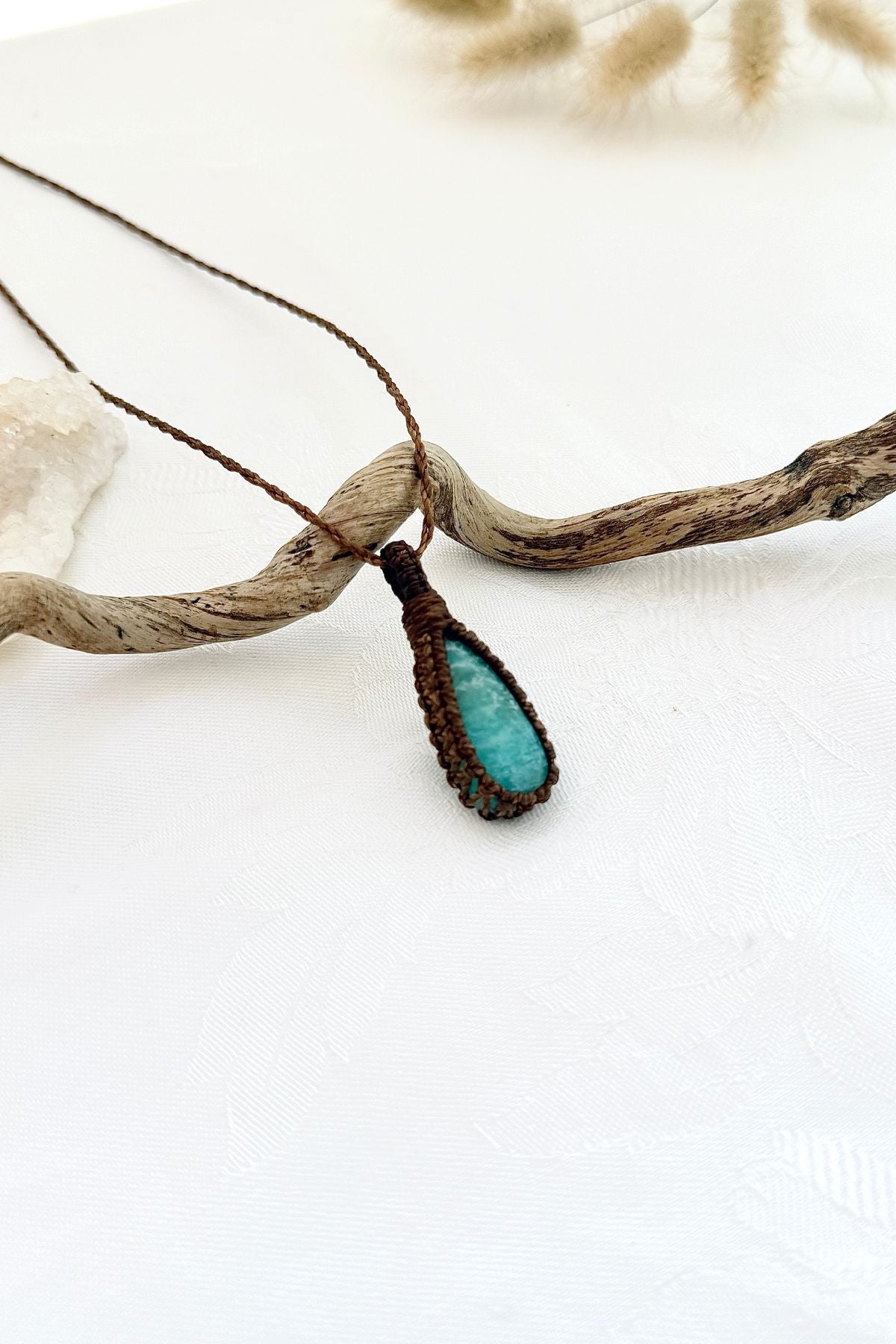 Handmade Amazonite macramé necklace, side view showing the gemstone and macramé knotting