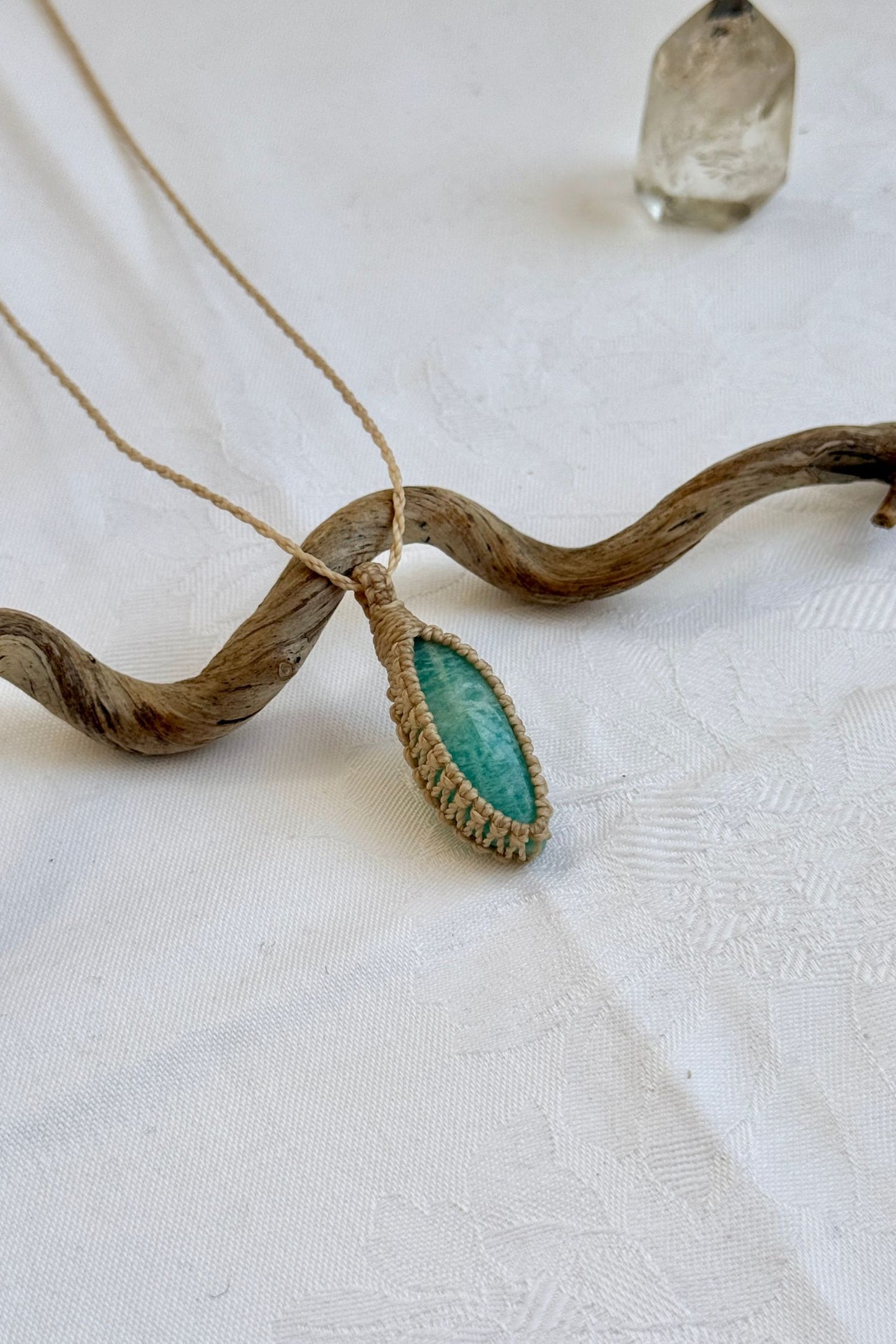 Another side angle shot of the handmade Amazonite Macrame necklace, emphasizing the elegant craftsmanship and natural gemstone colors.