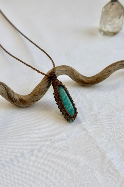 Another side angle shot of the handmade Amazonite Macrame necklace, emphasizing the elegant craftsmanship and natural gemstone colors.