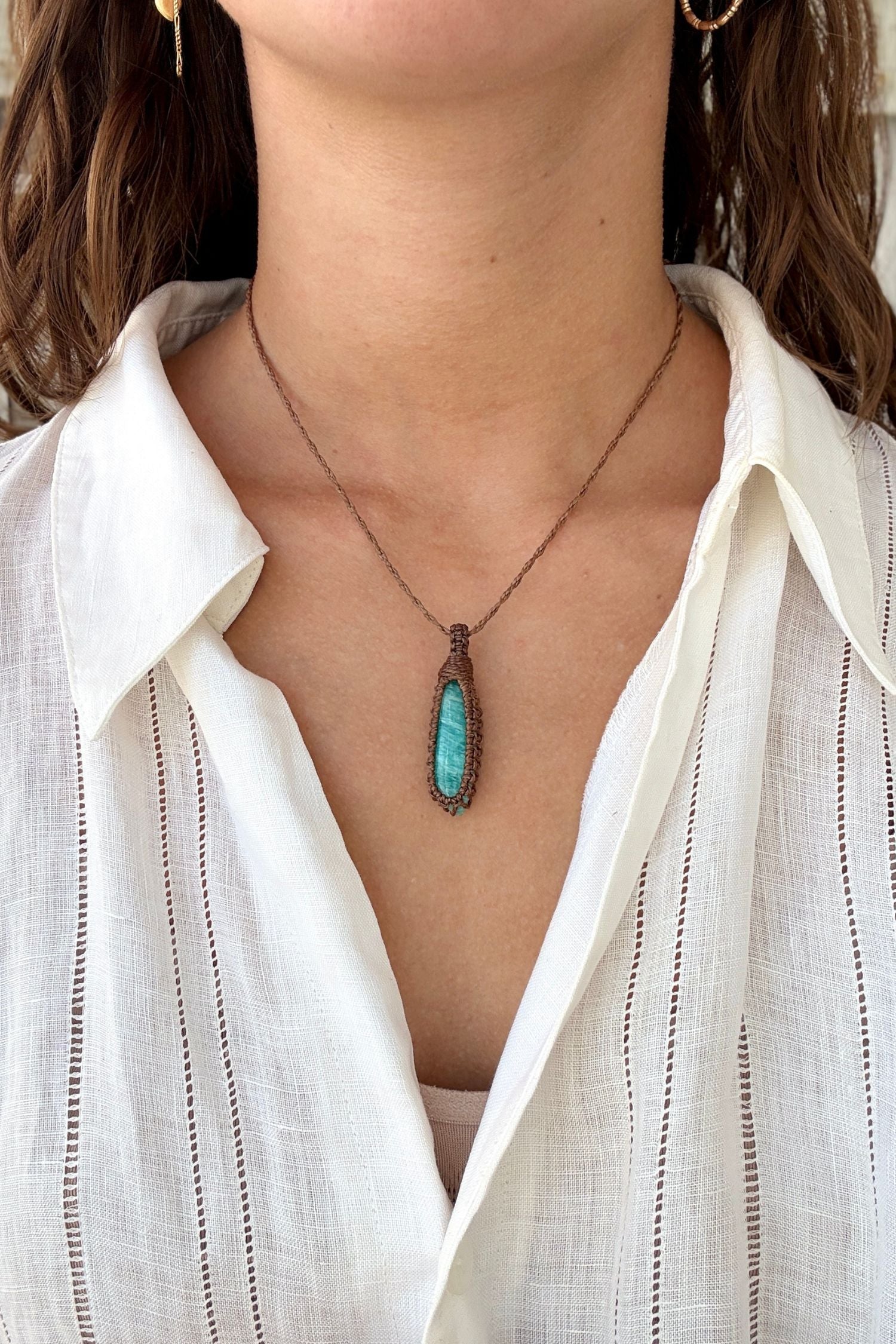 Model wearing a delicate handmade Amazonite macrame necklace with a brown cord, perfect for everyday wear.
