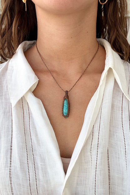 Model wearing a delicate handmade Amazonite macrame necklace with a brown cord, perfect for everyday wear.