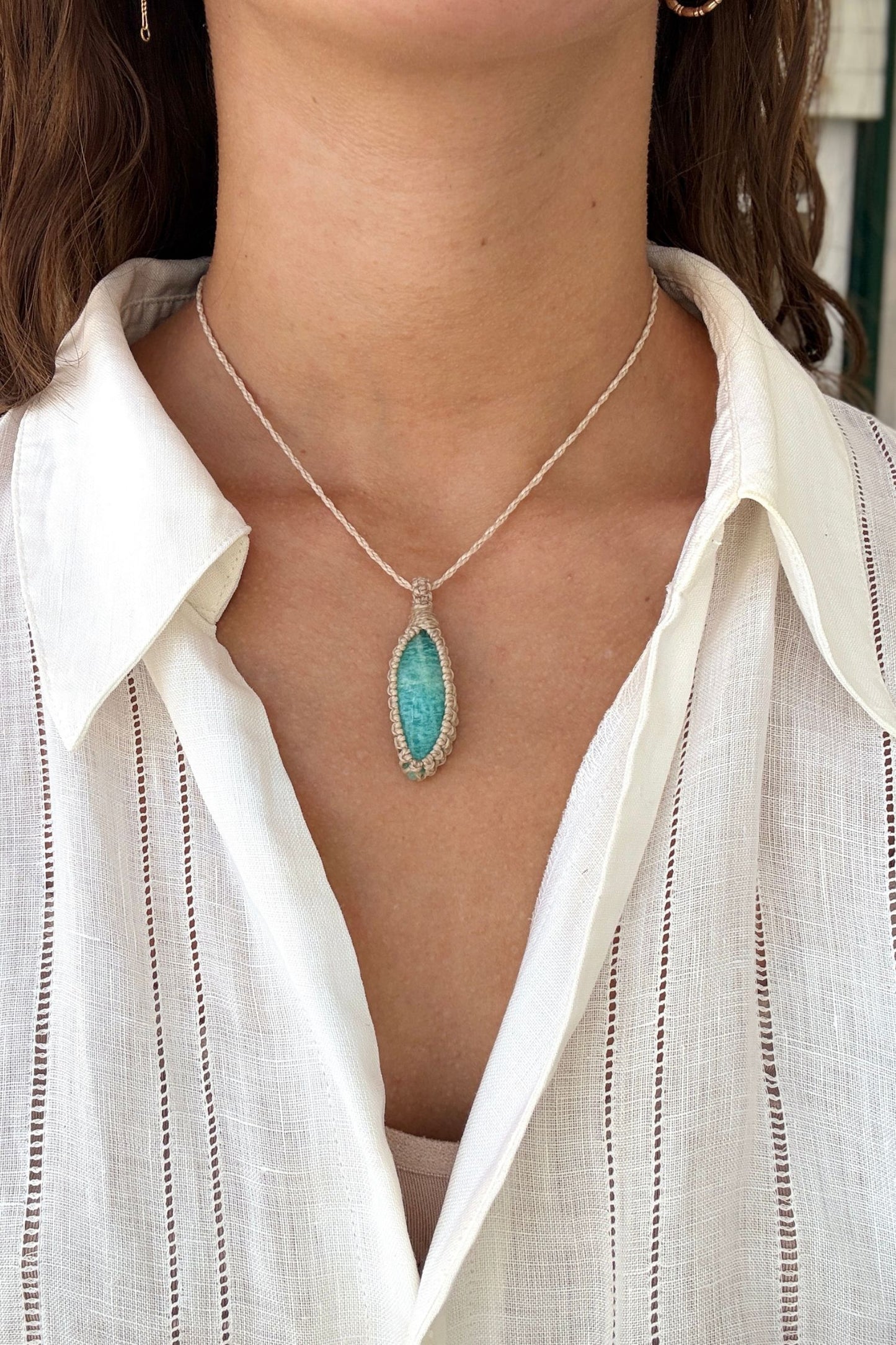 Model wearing a delicate handmade Amazonite macrame necklace with a beige cord, perfect for everyday wear.