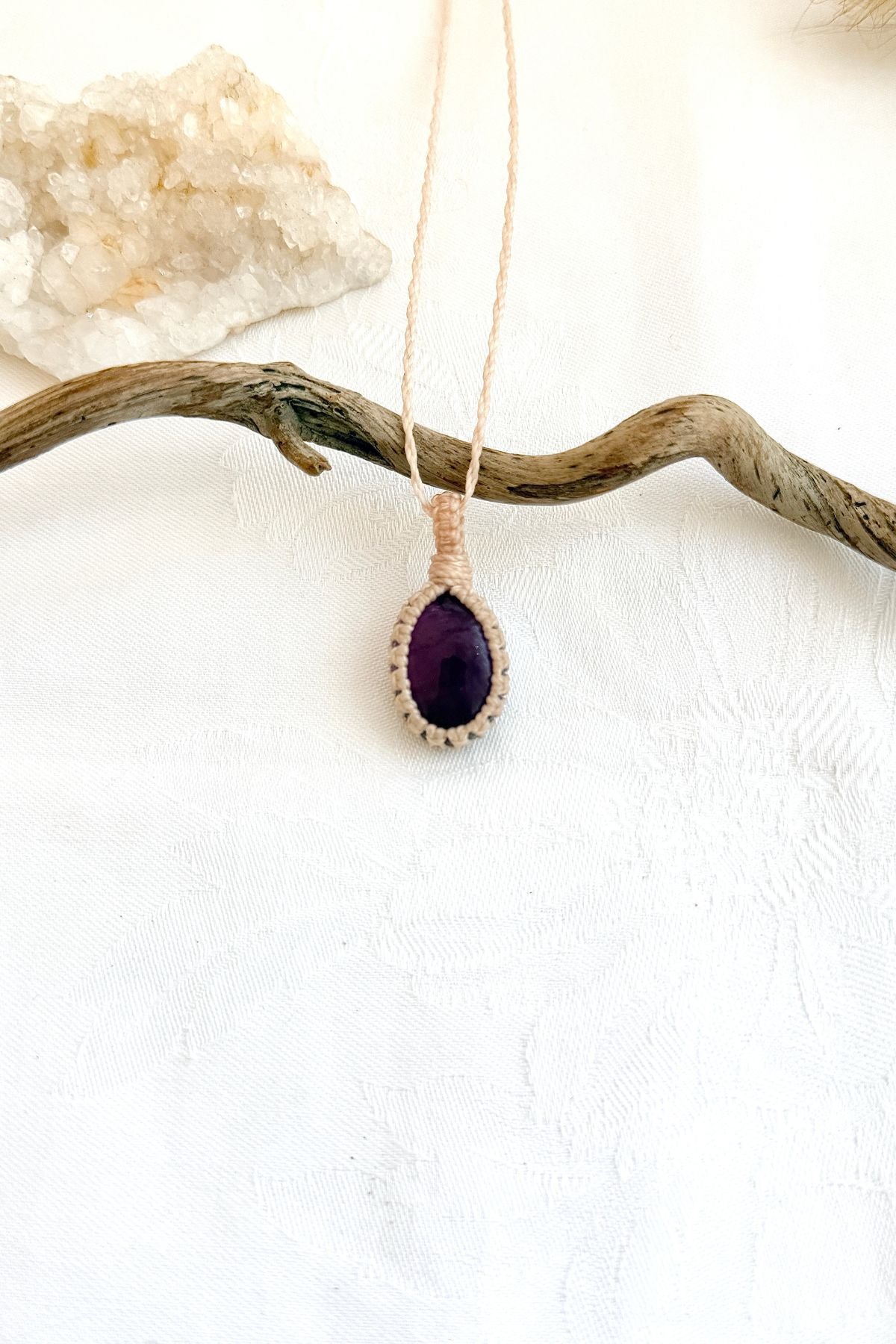 Handmade Amethyst macramé necklace, front view of natural gemstone pendant