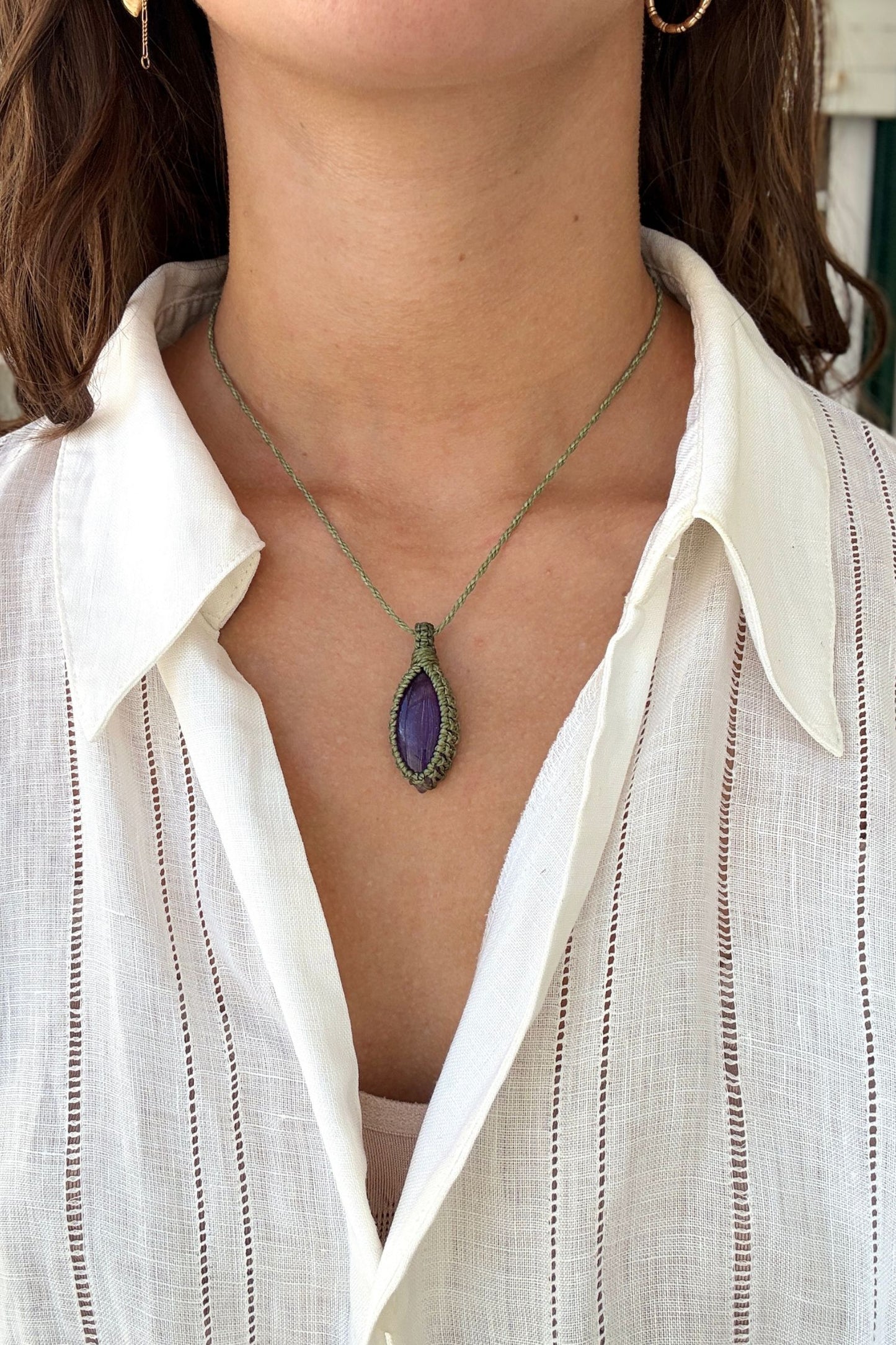 Model wearing a delicate handmade Amethyst macrame necklace with a green cord, perfect for everyday wear.