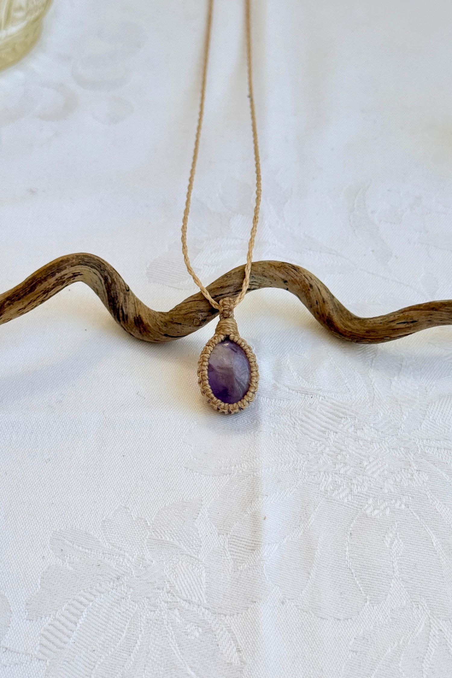 Handmade Ametrine Macrame necklace featuring a high-quality gemstone, laid flat to showcase its delicate everyday-wear design from the Essence collection.