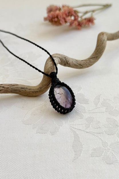 Alternate side view of a handmade Ametrine macrame necklace, focusing on the gemstone’s natural glow.