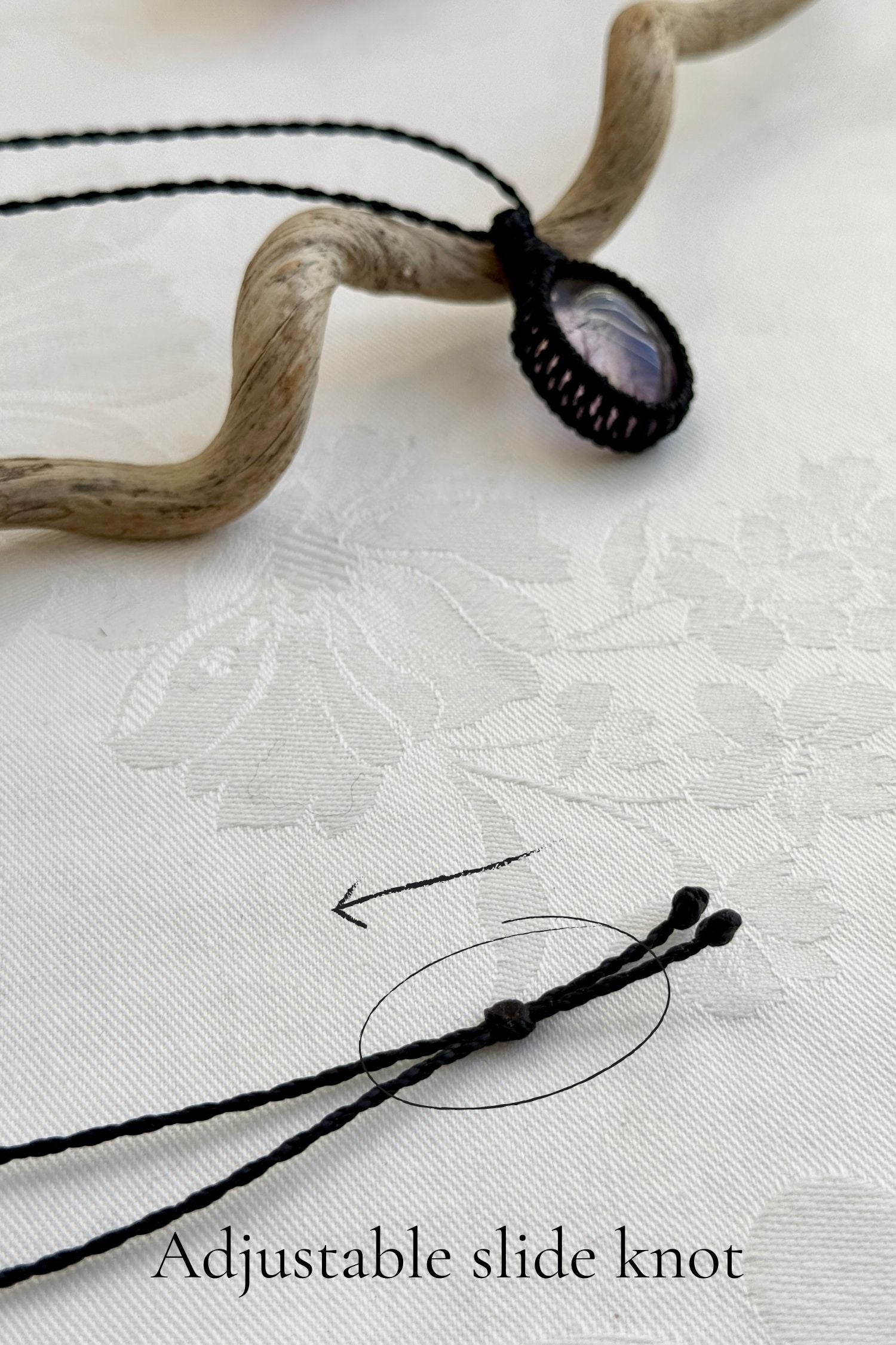 Close-up of the adjustable sliding lock on a handmade Ametrine macrame necklace, ensuring a perfect fit for all sizes.