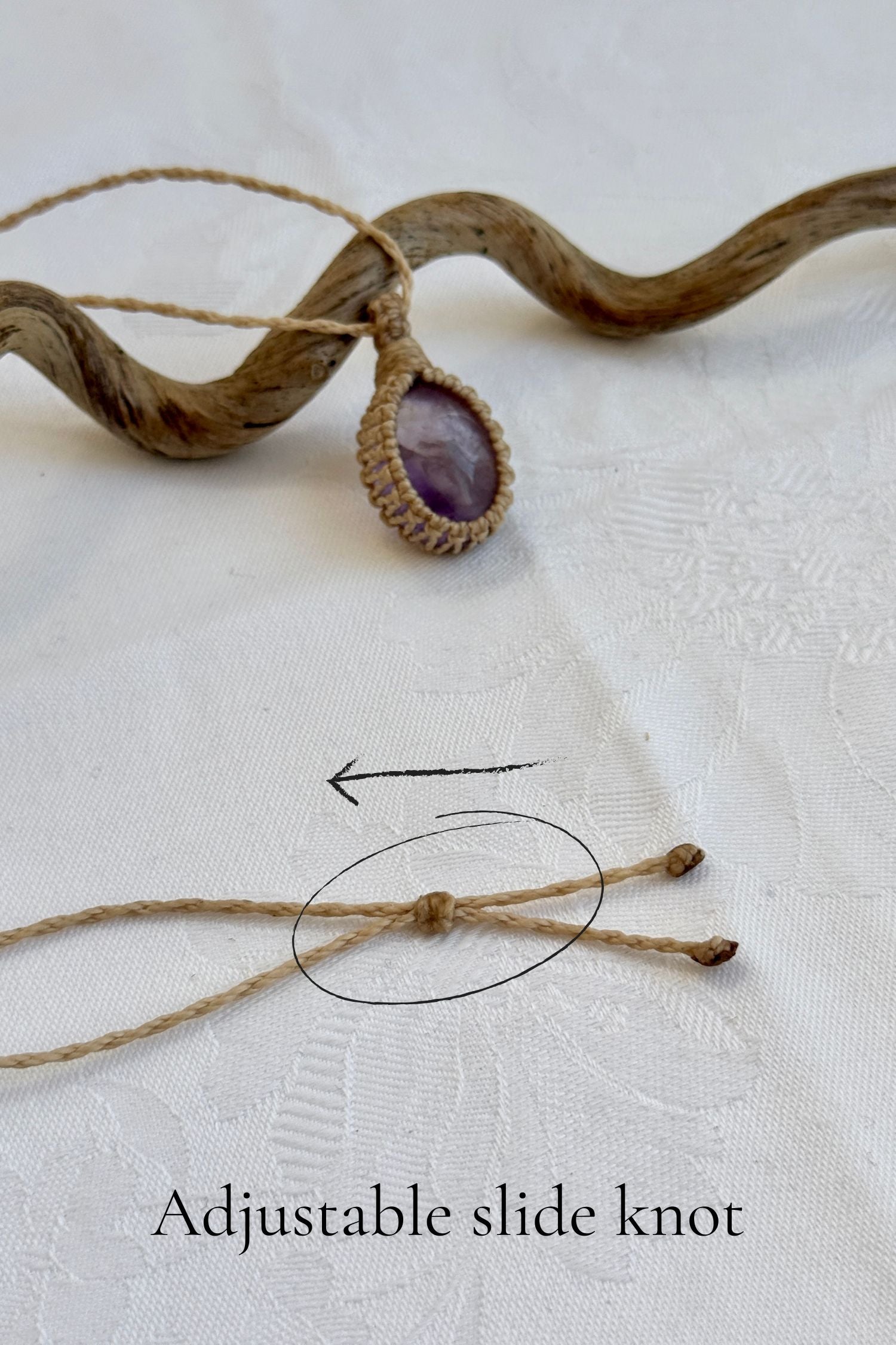 Close-up of the adjustable sliding knot on the Ametrine Macrame necklace, allowing for an easy and customizable fit for any wearer.