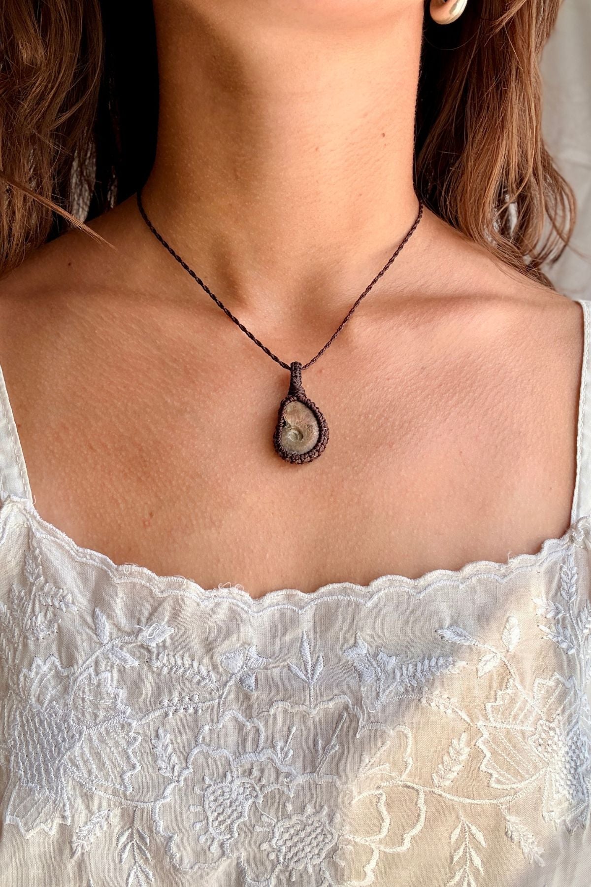 Model wearing a handmade Ammonite macramé necklace, delicate everyday jewelry