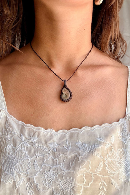 Model wearing a handmade Ammonite macramé necklace, delicate everyday jewelry