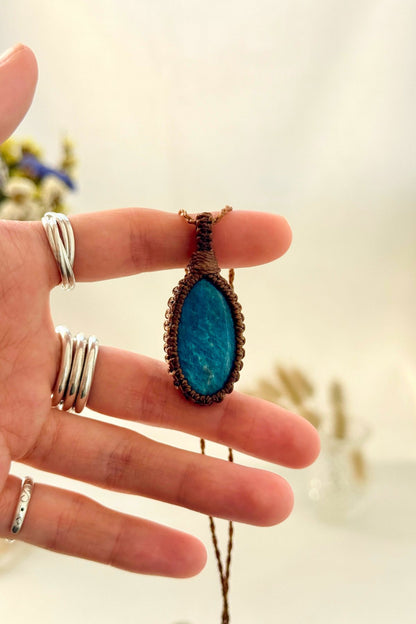 Handmade Apatite macramé necklace held in hand, delicate natural gemstone jewelry