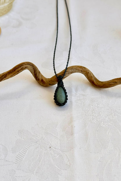 Handmade Aquamarine Macrame necklace featuring a high-quality gemstone, laid flat to showcase its delicate everyday-wear design from the Essence collection.