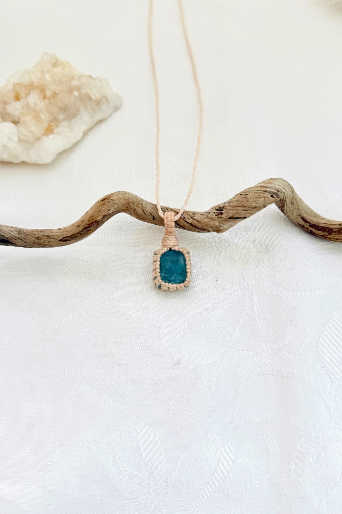 Handmade Aquamarine macramé necklace, front view of natural gemstone pendant