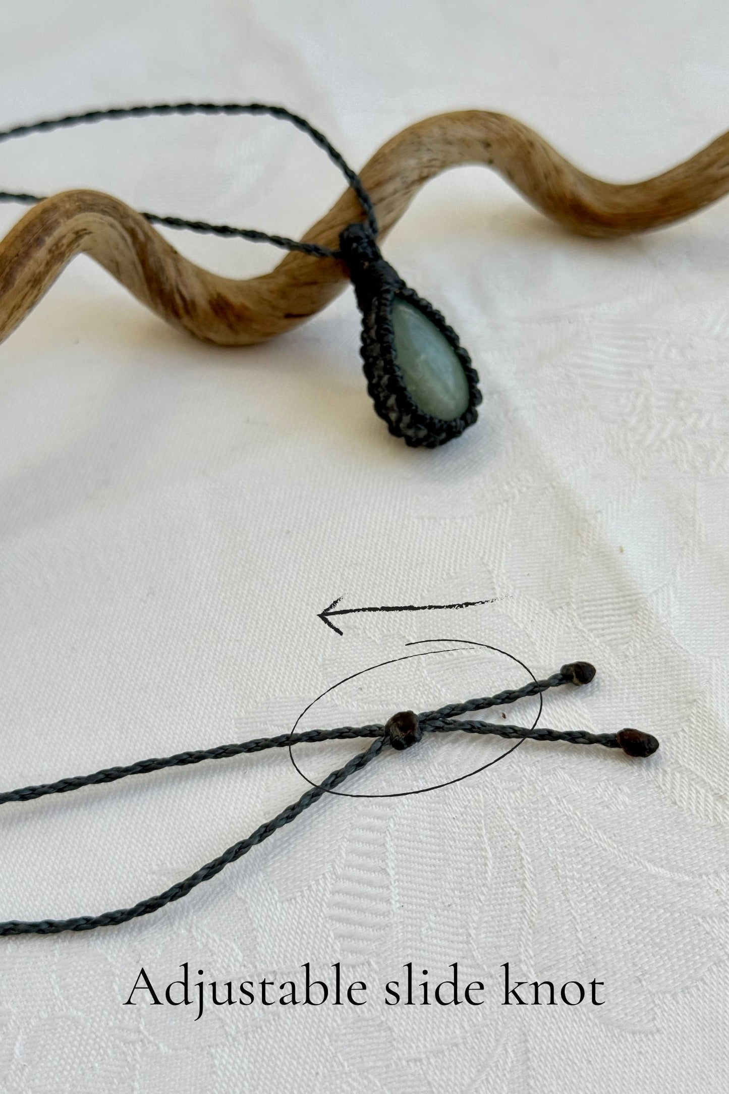 Close-up of the adjustable sliding knot on the Aquamarine Macrame necklace, allowing for an easy and customizable fit for any wearer.