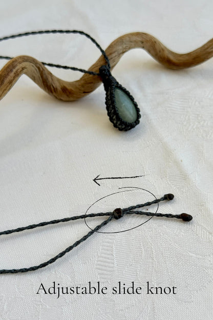 Close-up of the adjustable sliding knot on the Aquamarine Macrame necklace, allowing for an easy and customizable fit for any wearer.