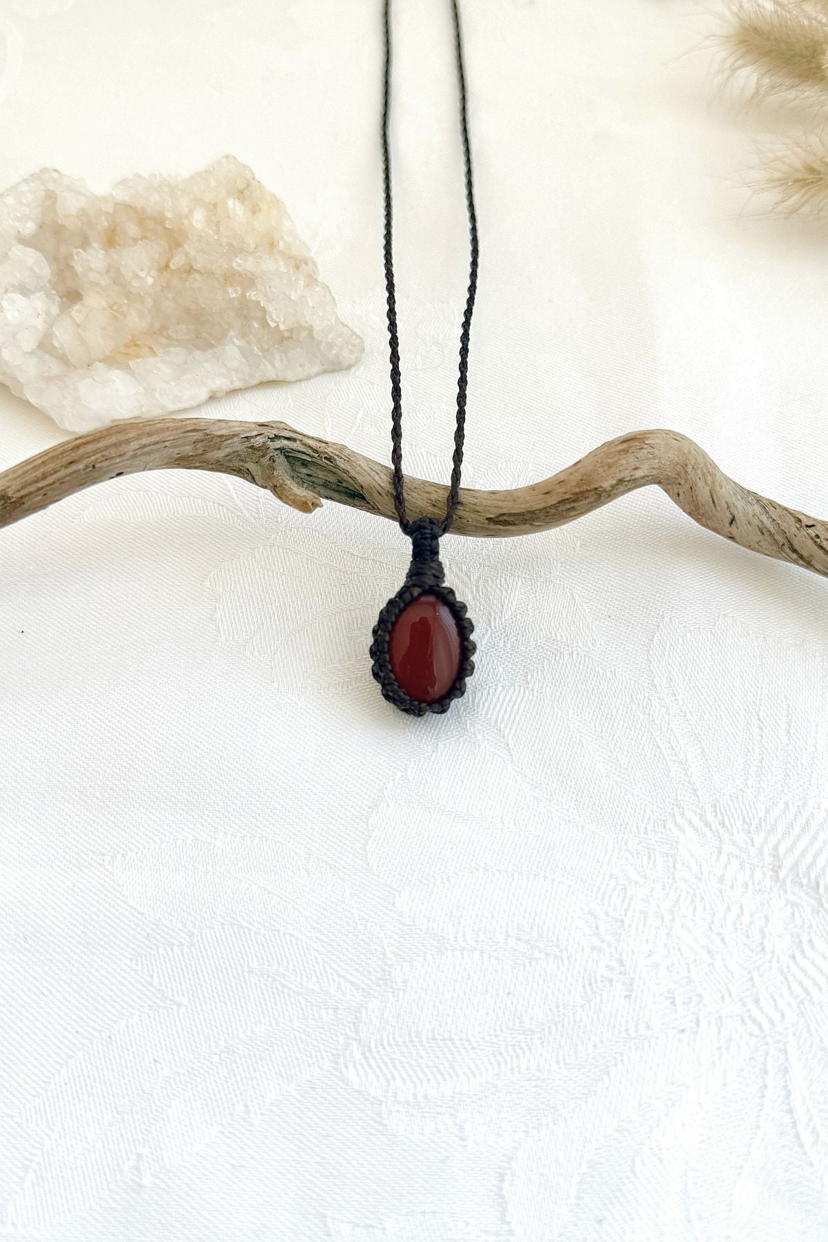 Handmade Carnelian macramé necklace, front view of natural gemstone pendant