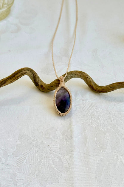 Handmade Chevron Amethyst Macrame necklace featuring a high-quality gemstone, laid flat to showcase its delicate everyday-wear design from the Essence collection.