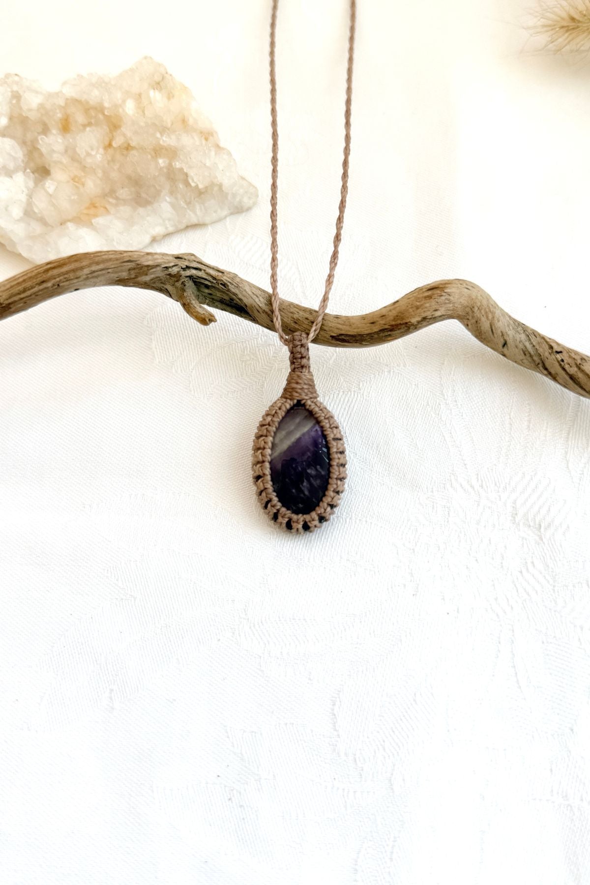 Handmade Chevron Amethyst macramé necklace, front view of natural gemstone pendant