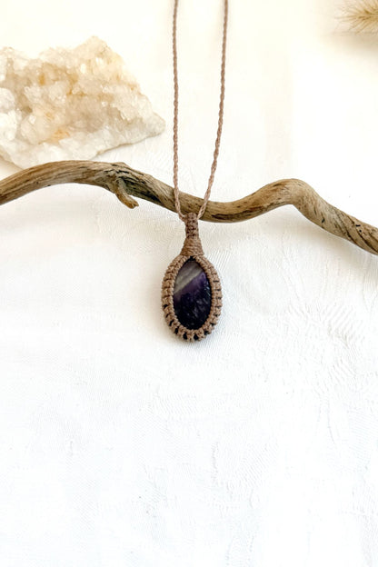 Handmade Chevron Amethyst macramé necklace, front view of natural gemstone pendant
