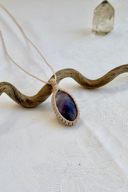 Another side angle shot of the handmade Chevron Amethyst Macrame necklace, emphasizing the elegant craftsmanship and natural gemstone colors.