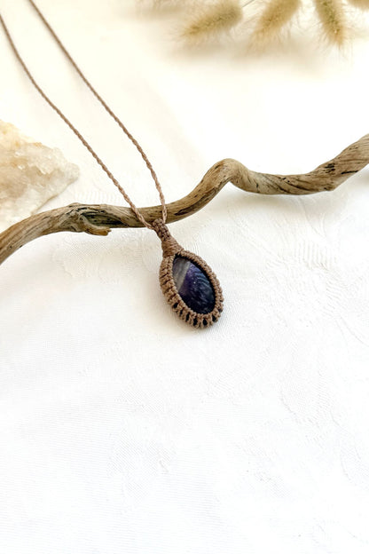 Handmade Chevron Amethyst macramé necklace, side view showing the gemstone and macramé knotting