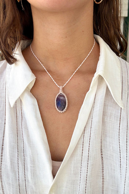 Model wearing a delicate handmade Chevron Amethyst macrame necklace with a white cord, perfect for everyday wear.