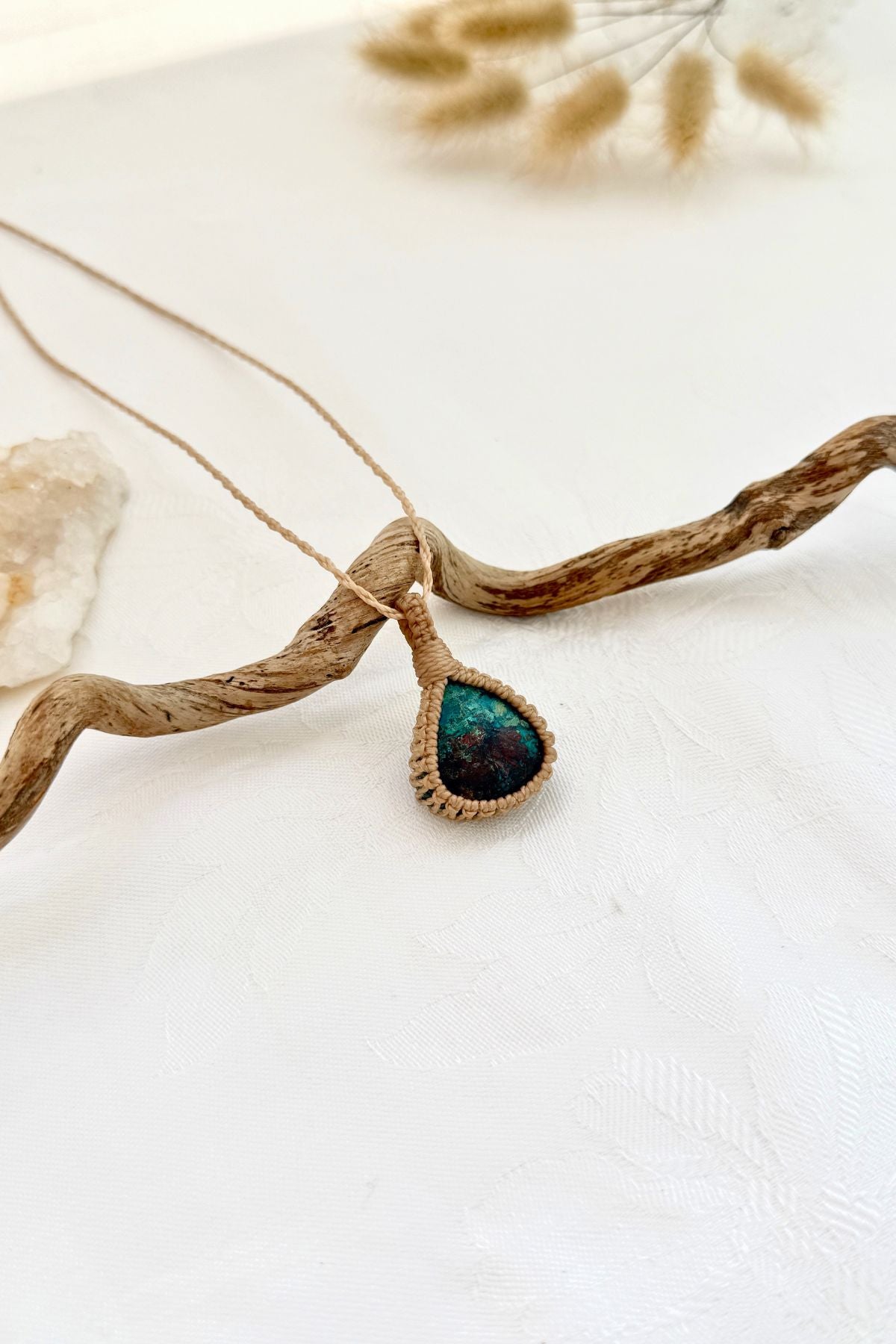 Handmade Chrysocolla macramé necklace, side view showing the gemstone and macramé knotting