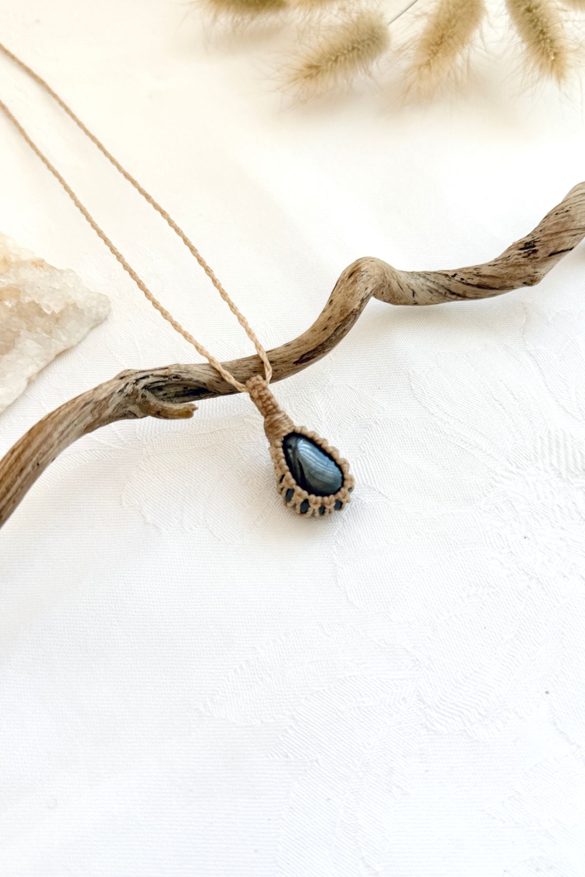 Handmade Hematite macramé necklace, side view showing the gemstone and macramé knotting