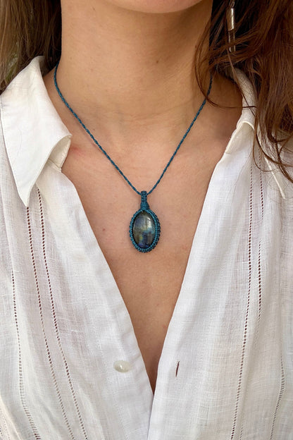 Model wearing a delicate handmade Labradorite macrame necklace with a blue cord, perfect for everyday wear.