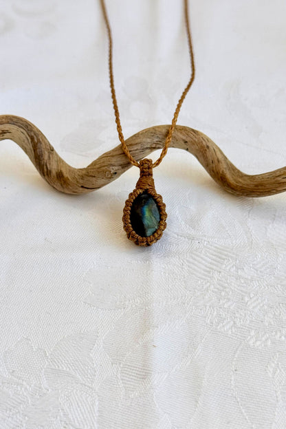 Handmade Labradorite Macrame necklace featuring a high-quality gemstone, laid flat to showcase its delicate everyday-wear design from the Essence collection.