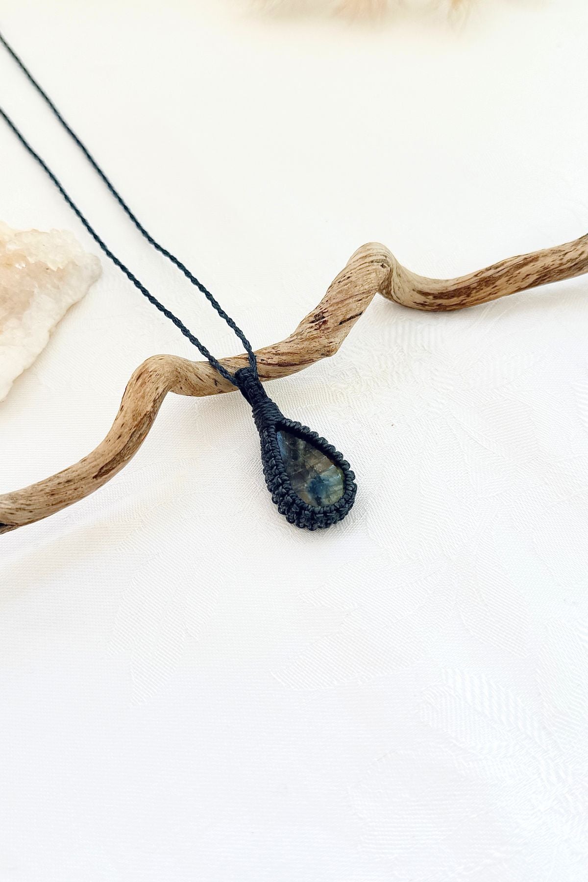 Handmade Labradorite macramé necklace, side view showing the gemstone and macramé knotting