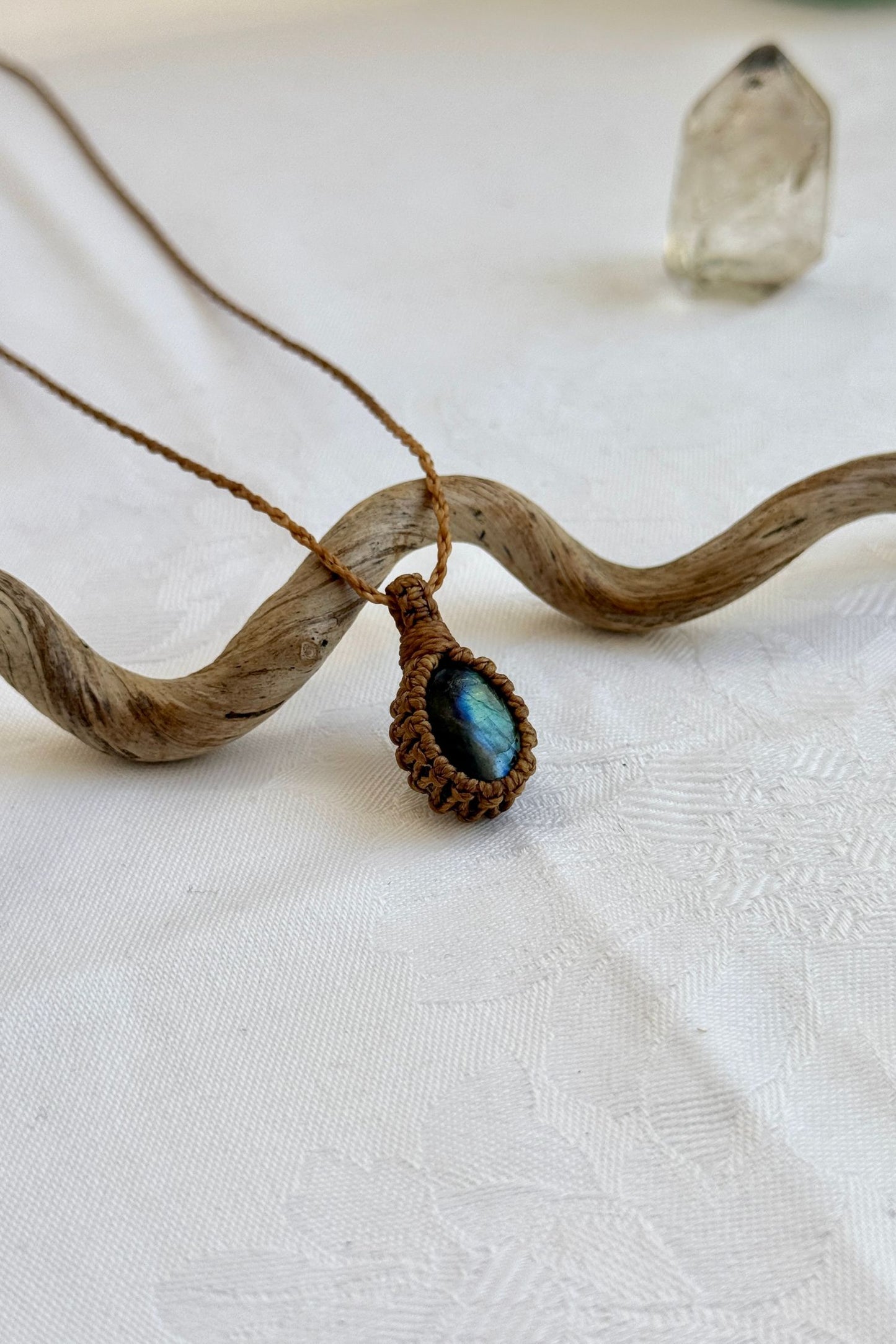 Another side angle shot of the handmade Labradorite Macrame necklace, emphasizing the elegant craftsmanship and natural gemstone colors.