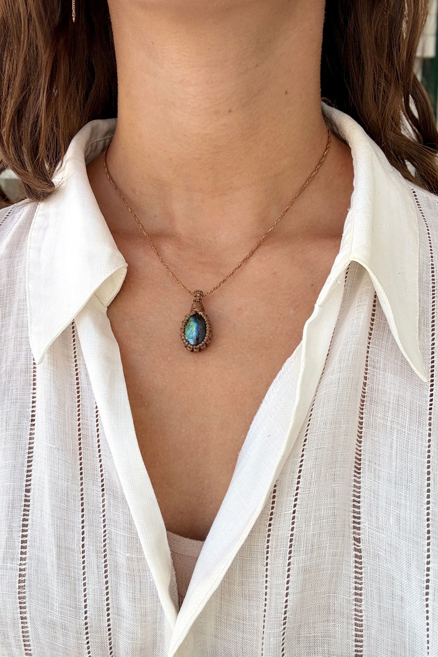Model wearing a delicate handmade Labradorite macrame necklace with a brown cord, perfect for everyday wear.