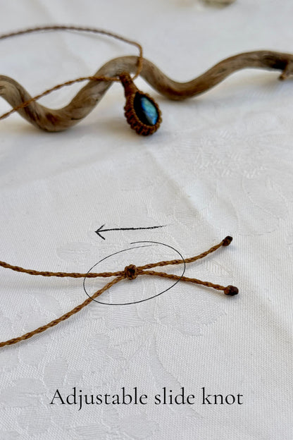Close-up of the adjustable sliding knot on the Labradorite Macrame necklace, allowing for an easy and customizable fit for any wearer.
