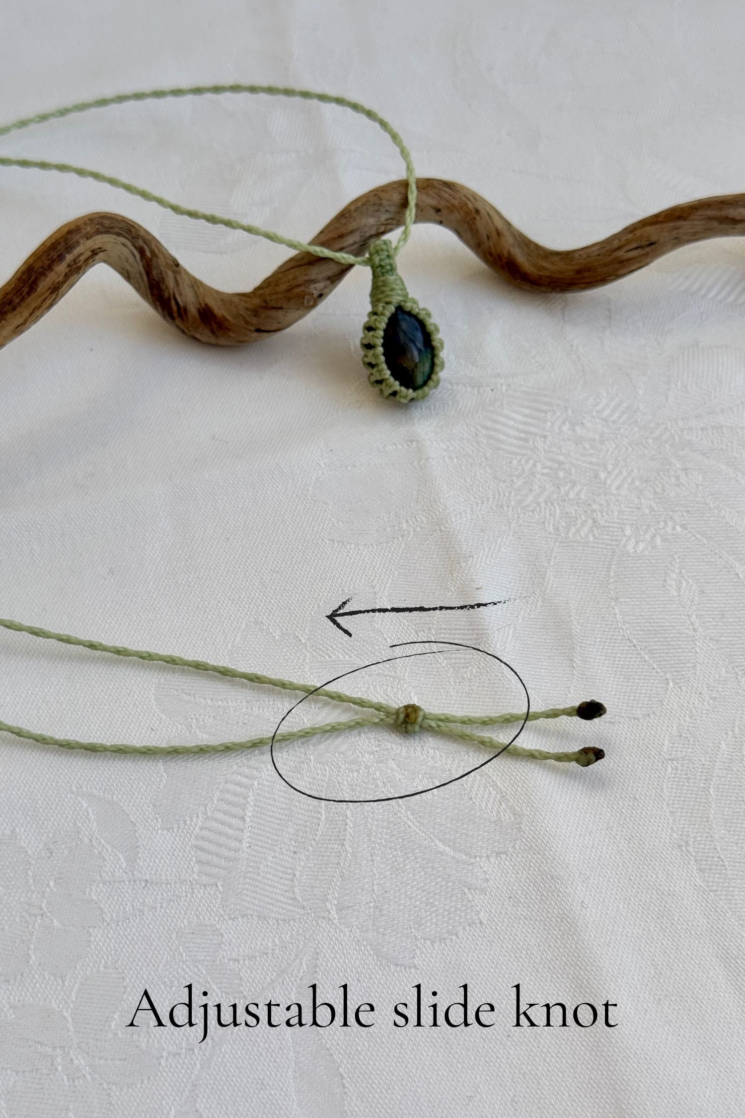 Close-up of the adjustable sliding knot on the Labradorite Macrame necklace, allowing for an easy and customizable fit for any wearer.