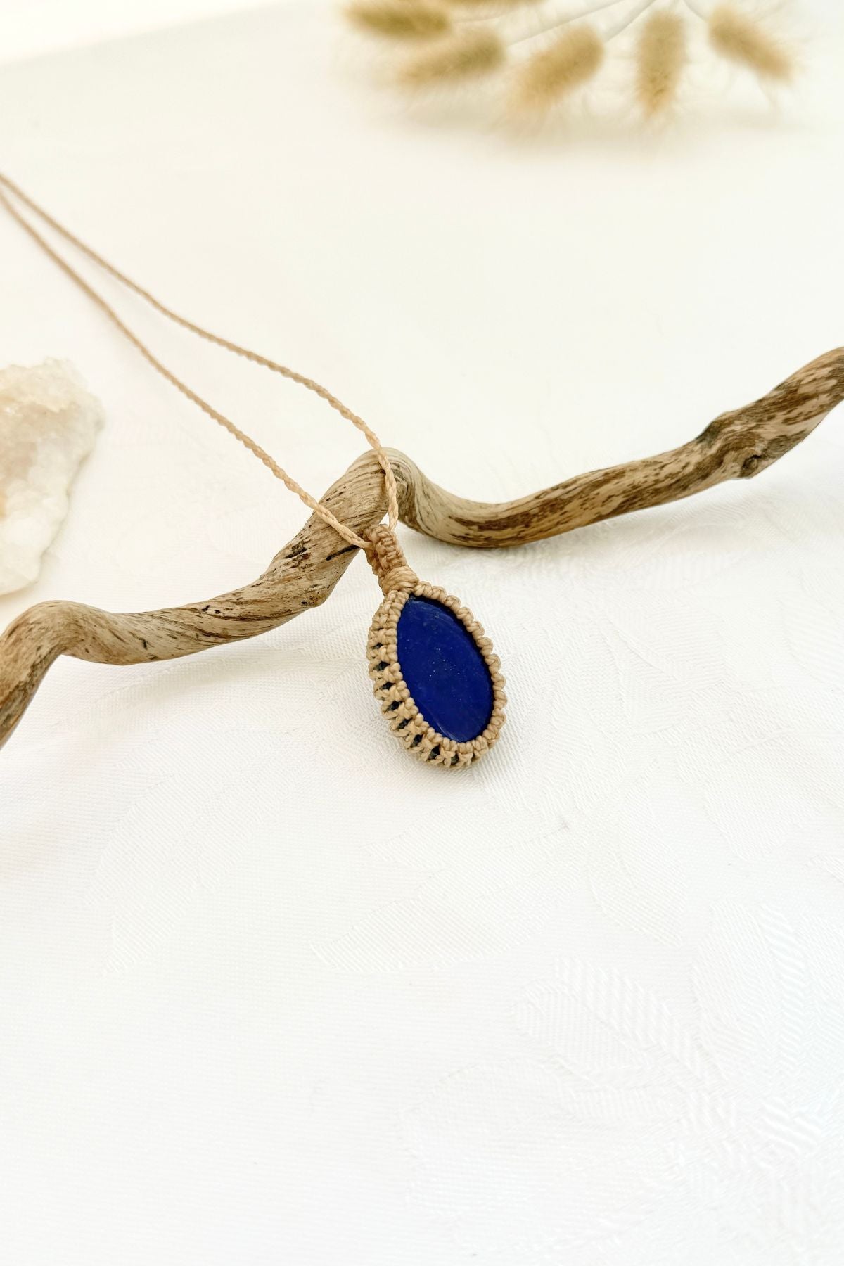 Handmade Lapis Lazuli macramé necklace, side view showing the gemstone and macramé knotting