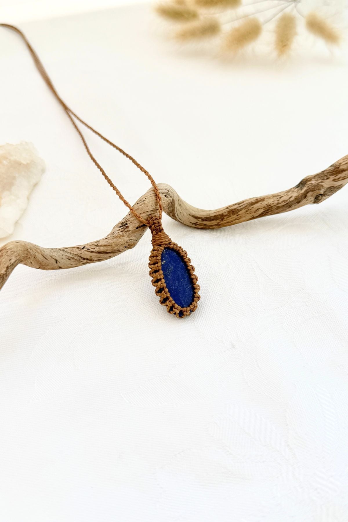 Handmade Lapis Lazuli macramé necklace, side view showing the gemstone and macramé knotting