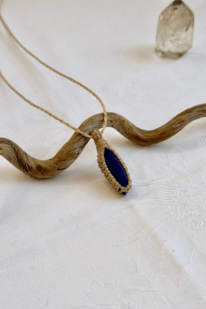 Another side angle shot of the handmade Lapis Lazuli Macrame necklace, emphasizing the elegant craftsmanship and natural gemstone colors.