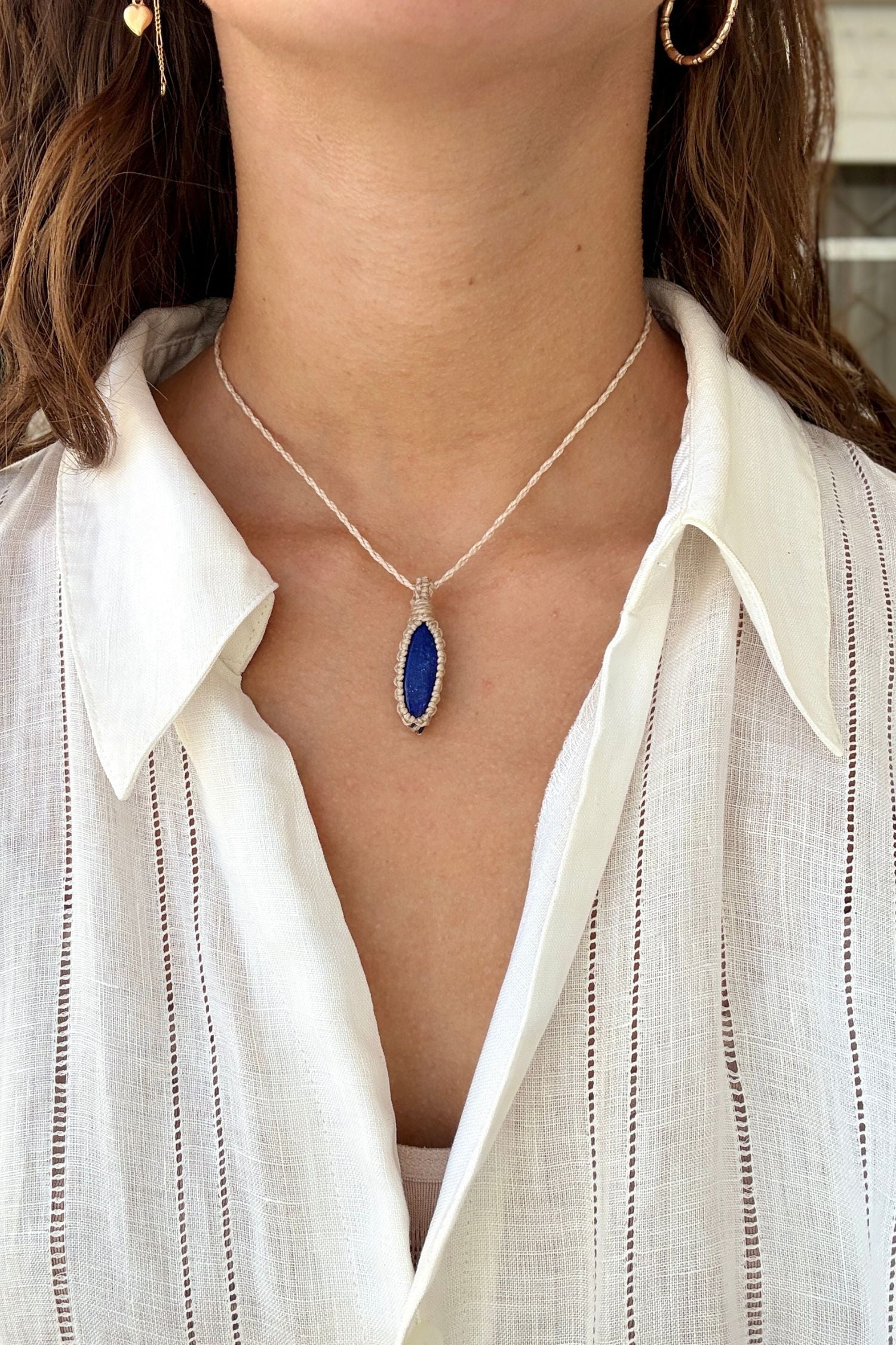 Model wearing a delicate handmade Lapis Lazuli macrame necklace with a beige cord, perfect for everyday wear.