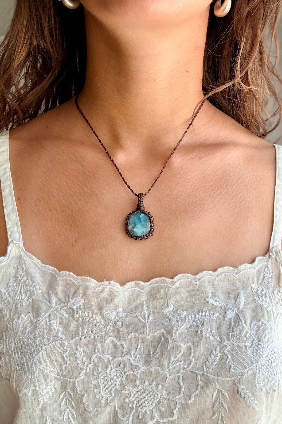 Model wearing a handmade Larimar macramé necklace, delicate everyday jewelry