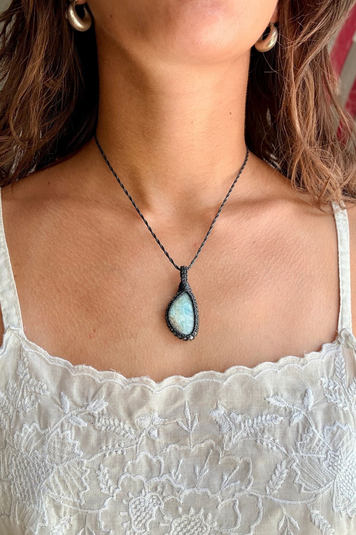 Model wearing a handmade Larimar macramé necklace, delicate everyday jewelry