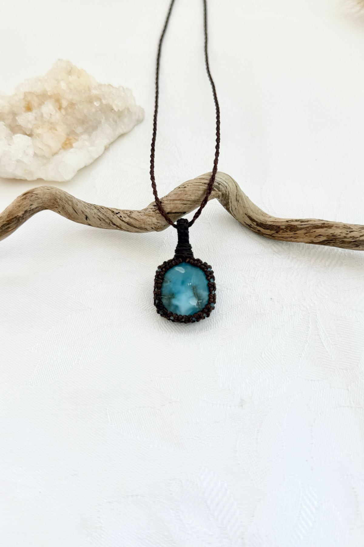 Handmade Larimar macramé necklace, front view of natural gemstone pendant