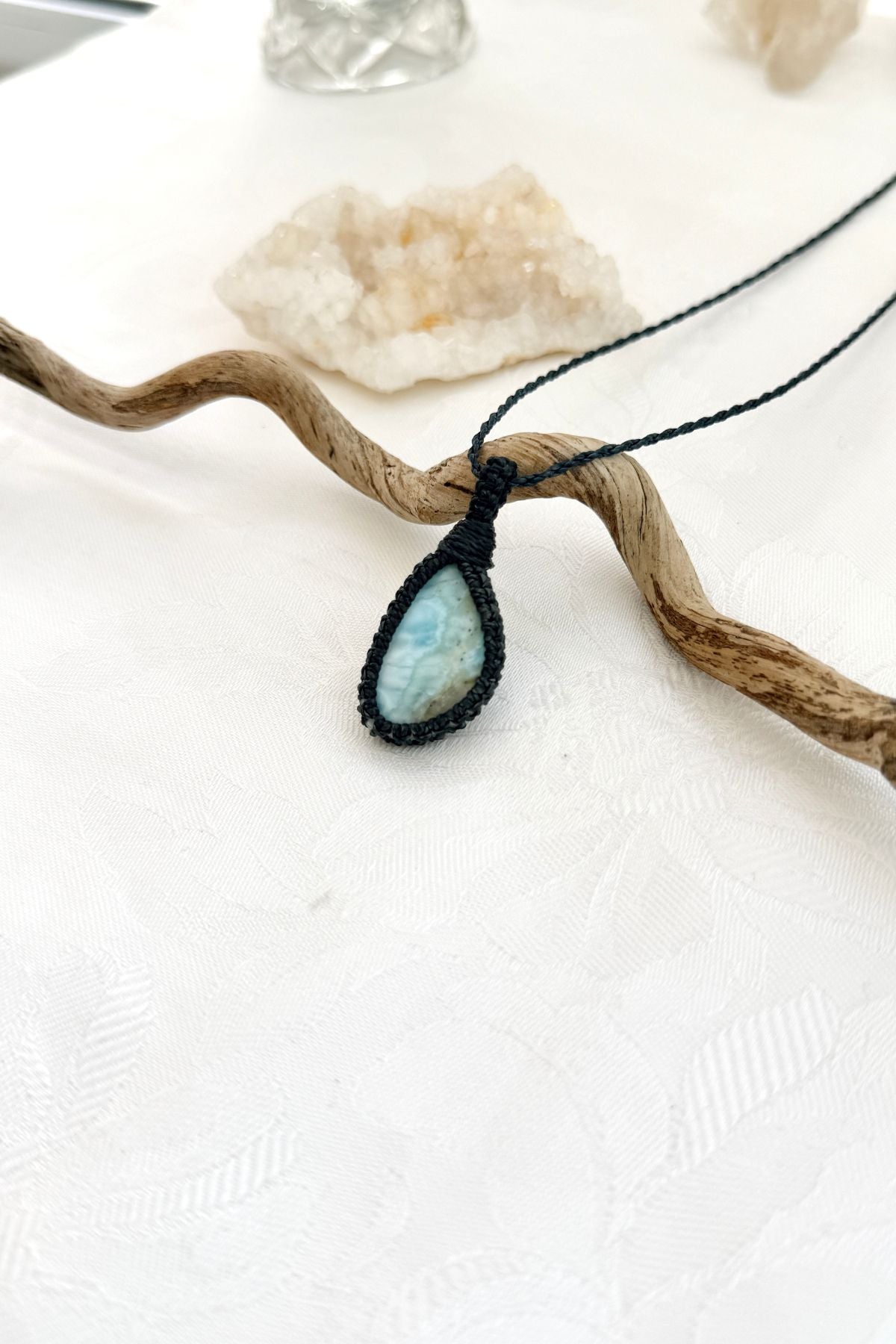 Handmade Larimar macramé necklace, side view showing the gemstone and macramé knotting