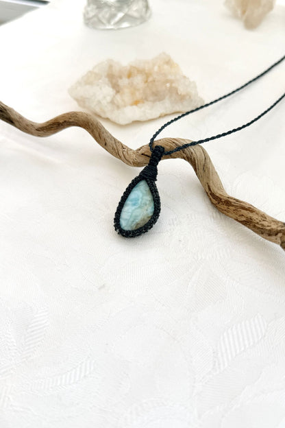 Handmade Larimar macramé necklace, side view showing the gemstone and macramé knotting