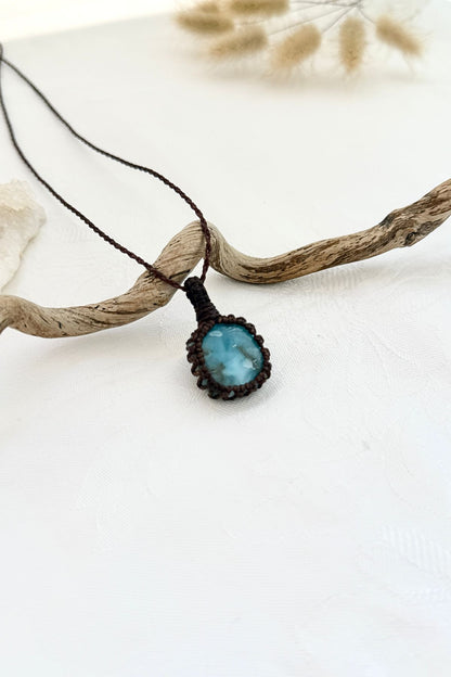 Handmade Larimar macramé necklace, side view showing the gemstone and macramé knotting