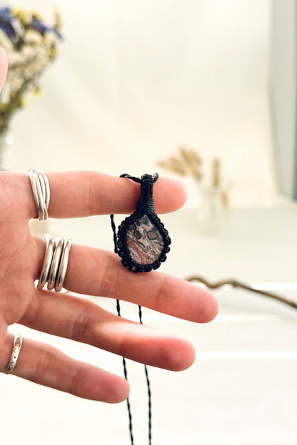 Handmade Leopard Jasper macramé necklace held in hand, delicate natural gemstone jewelry